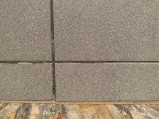 Gray grid block wall with marble, concrete wall background, Tiled floor