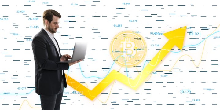 A businessman using a laptop with bitcoin and stock market graphics in the background, concept of cryptocurrency and finance