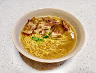 traditional famous authentic hong kong chinese beef brisket noodle soup street food stall in local restaurant at kowloon tsim sha tsui hong kong