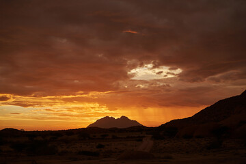 African Sunset Over Cliffs: Embracing Freedom, Nature, and Simple Values