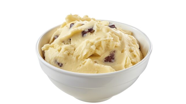A bowl of British spotted dick with custard on a white background.