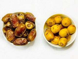 Fresh dates in bowl on white background 