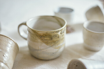 Ceramic cup on a textile