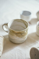 Ceramic cup on a textile