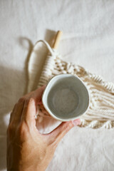 Ceramic cup on a textile