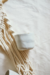 Ceramic cup on a textile