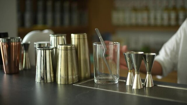 Bar Tools and Glassware on a Countertop