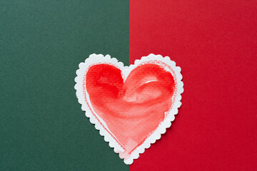 retro-styled red heart on green and red paper