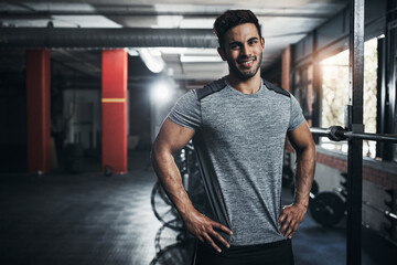 Man, portrait and happy in gym for fitness, bodybuilding and personal training for health or muscle strength. Male person, sports athlete and proud for active living, exercise and cardio workout.