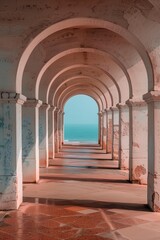 Obraz premium A long, narrow hallway with white pillars and a blue sky in the background. The hallway is empty and the only person visible is a shadow on the wall