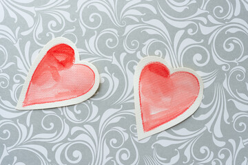 two hearts on decorative paper