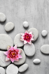 Japanese zen garden meditation stone and flowers for harmony and balance.