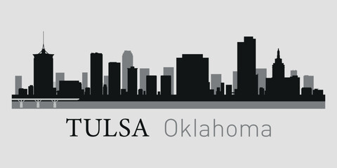 The city skyline. Tulsa, Oklahoma. Silhouettes of buildings. Vector on a gray background	
