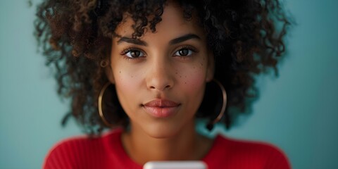 Fototapeta premium Concerned Young Black Woman with Phone at Risk of Online Crime. Concept Online Safety, Cybersecurity, Personal Protection, Digital Privacy, Internet Threats,