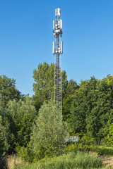 Obraz premium Mobile data transmission tower for 4G and 5G in a park Utrecht, Holland