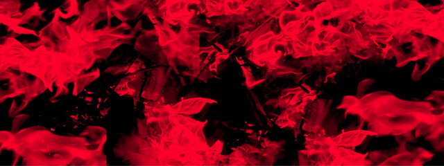 Abstract red fire in dark background. Grunge texture black and red color background. Festive New Year grunge background with Flowering design.