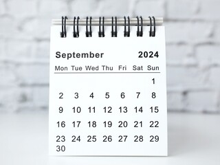 September 2024 white monthly desk calendar on a table
