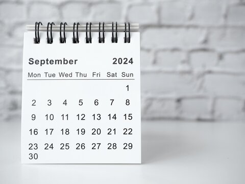 September 2024 white monthly desk calendar on a table
