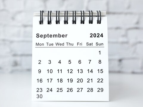 September 2024 white monthly desk calendar on a table