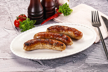 Delicous natural roasted sausages in the plate