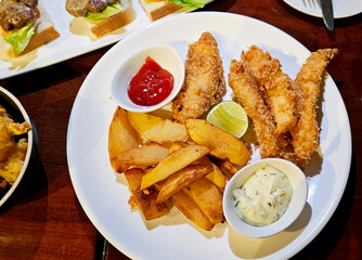 Fish and chips with french fries, tartar sauce
