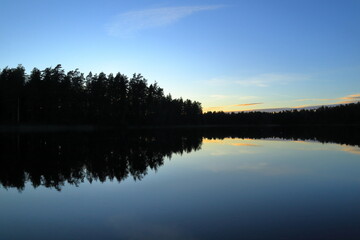 Sunset at a lake. Summer evening in nature. Ekenäs, Finland.