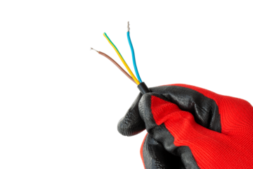 Electrician holding the ends of an electrical cable, multi-colored bundle of electrical cables, isolated, close-up