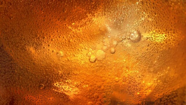 Carbonated Drink Fizzing With Ice Extreme Closeup