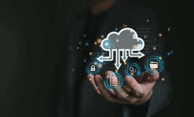 Business person migrate data and corporate information into cloud technology for data security and...
