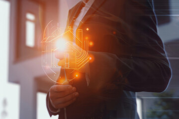 A dynamic business-themed image featuring a silhouette of a person in a suit with a digital hologram of a house overlay, glowing with innovation.