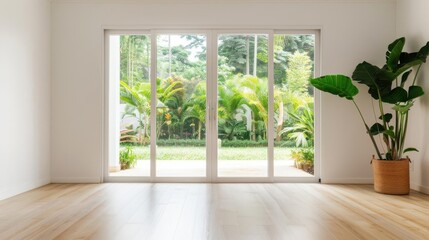Fototapeta premium Sunlit room with sliding doors leading to a vibrant garden, featuring minimalistic decor and natural wooden flooring