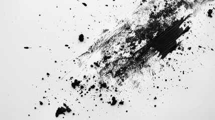 Black eraser residue on white surface viewed from above