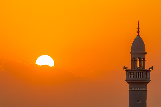 silhouette of mosque in sunset