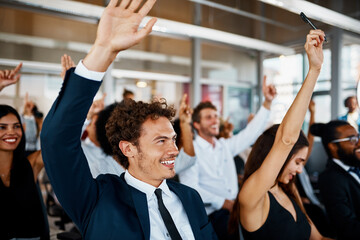 Happy, business people and meeting with question for presentation, interaction or engagement at office. Team or group of employees with hands raised or smile for collaboration, answer or conference