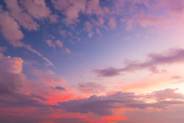 Fototapeta premium Clouds and orange sky,Real majestic sunrise sunset sky background with gentle colorful clouds without birds.Panorama, large 