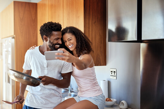 Happy couple, home and selfie for cooking, breakfast and bonding with together on weekend in morning. Woman, man and romance for Valentines Day, birthday and happiness with love, affection and care