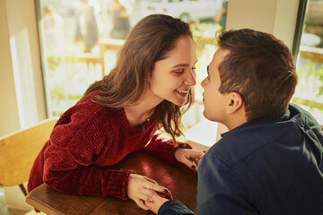 Romance, coffee shop and couple holding hands with love on anniversary, date and empathy with care....
