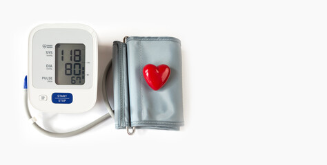 Medical electronic tonometer and red heart on a white background