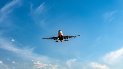 An airplane in the sky coming in for a landing. 