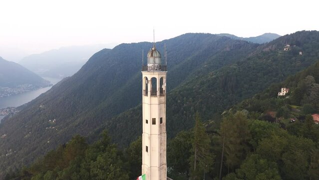 Aerial Reveal Pull Back Drone Footage of the Faro Voltiano Volta Lighthouse in Brunate, Como lake, Como province, Lombardy, Italy