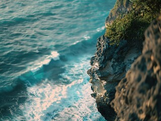 Person on Cliff Edge Next to Ocean