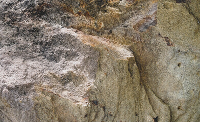 Empty grey orange sandstone wall with rust stain for abstract background and texture. Beautiful natural patterns, space for work, banner, wallpaper close up.