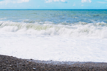 sea waves and foam off the coast