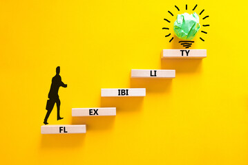 Flexibility symbol. Concept word Flexibility on beautiful wooden blocks. Businessman icon....