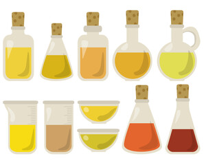 Set of various glassware with multi-colored liquids or vegetable oils, measuring and other glassware with and without stoppers