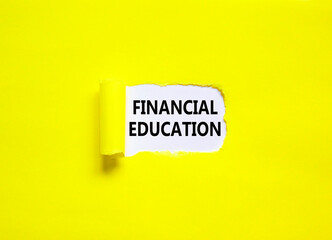 Financial education symbol. Concept words Financial education on beautiful white paper. Beautiful yellow paper background. Business Financial education concept. Copy space.