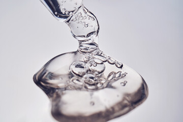 Pipette with cosmetic gel or serum close-up.