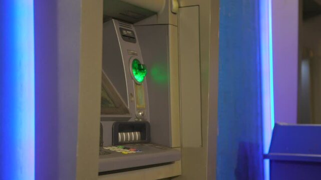 Flashing Green light at ATM machine downtown city 4k
