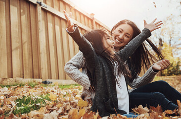 Asian, woman and girl in outdoor, park or garden with enjoying autumn, playing and fun for bonding....