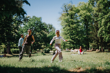 Group of friends enjoying a sunny day, chasing and playing in a lush park